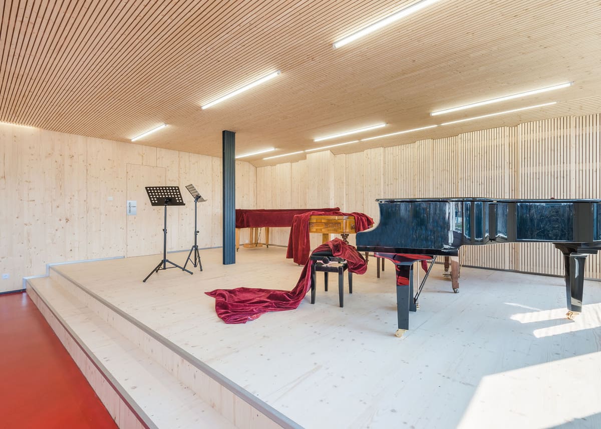 Novatop acoustic panels interior of musical room besides black piano